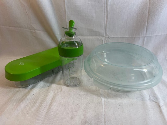 Salad prep lot - vegetable chopper, salad dressing container, food storage container.