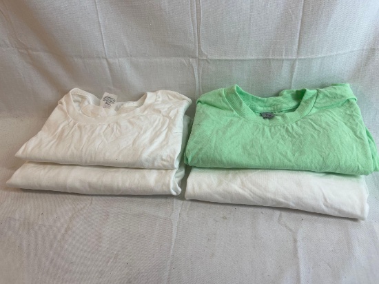 Solid t-shirt lot. Three white, one green. Size medium and Large....