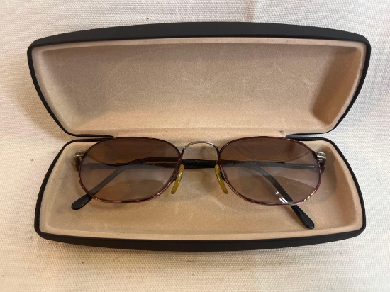 Wire framed bifocal glasses with case.