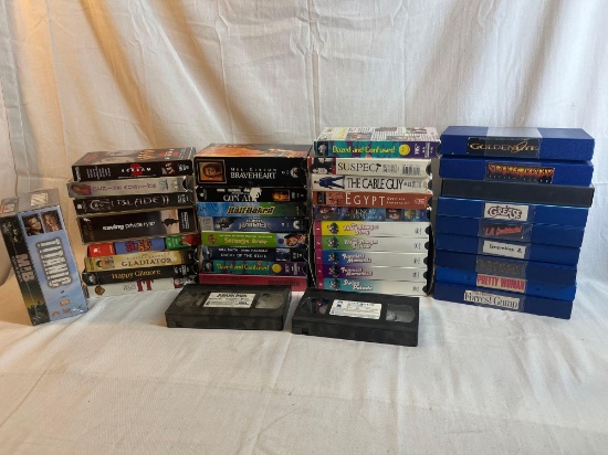 Large lot of VHS tapes. Men in Black and Titanic are new and sealed....