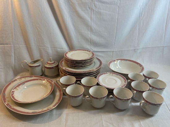 Large lot of dinnerware including plates, bowls, mugs, sugar bowl, creamer....Royal Majestic Fine
