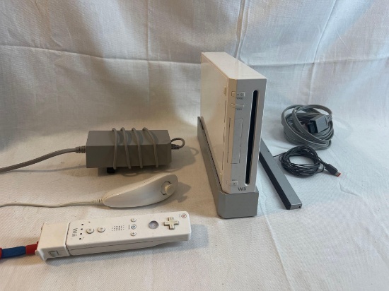 Wii console with stand, wiimote, nunchuck, tv sensor bar, power cord and av cable