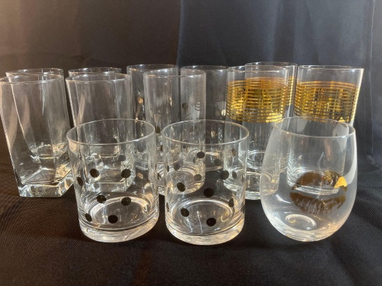 Set of glassware. Clear glass with gold accents.