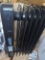 Pelonis 1,500-Watt Oil-Filled Radiant Electric Space Heater with Thermostat, Retail Price $55,
