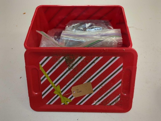 Christmas tote and contents including various worm fishing lures. Comes as is shown in photos.