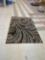 MACHINE MADE AREA RUG, BROWN AND GREY. STAINED, 58 1/4