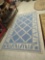 VINTAGE MACHINE MADE AREA RUG, BLUE ON IVORY. 60