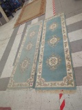 PAIR OF FLORAL MACHINE MADE RUNNER RUGS, 27