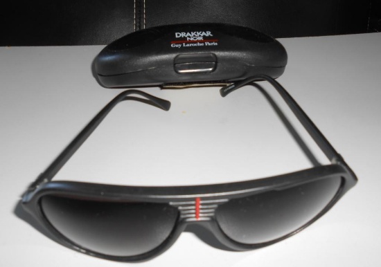 DRAKKAR NOIR SUNGLASSES WITH CASE ALL ITEMS ARE SOLD AS IS, WHERE IS, WITH NO GUARANTEE OR WARRANTY.