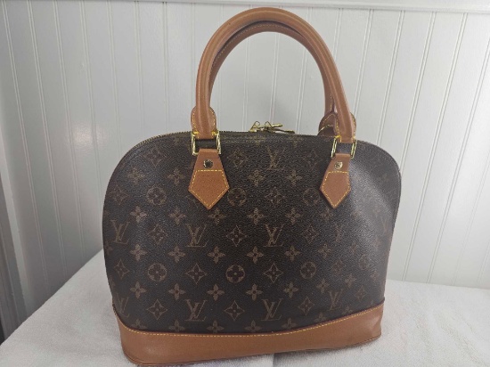 SuperClone LV Alma Hand Bag. Measures approx 7 x 12 x 10.5