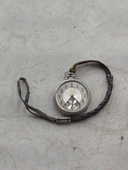 Silver Pocket Watch with Missing Glass and Worn Strap