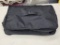 Black Travel Organizer with Handle and Straps in Opened Packaging