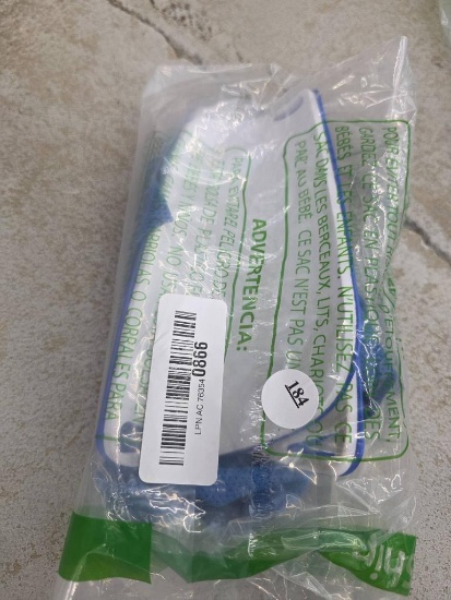 Packaged Blue Plastic Item with Barcode and Warning Label