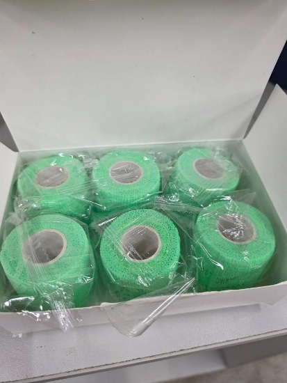 Six Green Adhesive Bandage Rolls