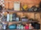 Wall Lot of Misc. Spark Plugs, Old Lawn Mower Parts, Radio, Water Can, and More