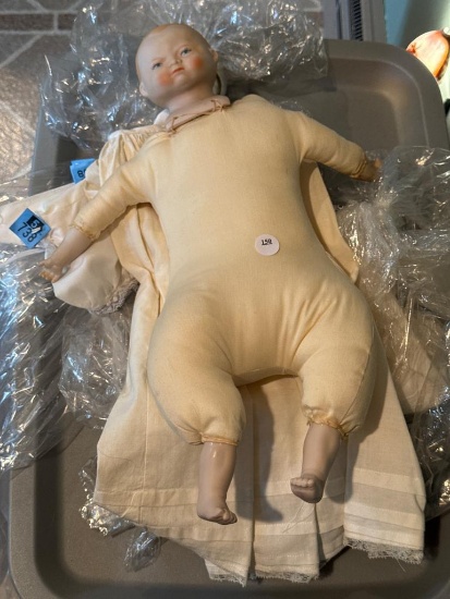 Porcelain Baby Doll with Cloth Body and Approximately 17 Inches Long