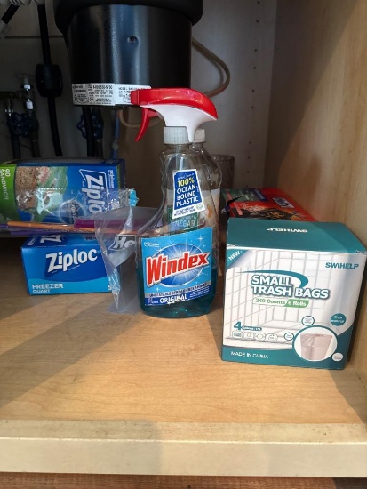 Cabinet Lot of Assorted Items Including Cleaning and Storage Supplies