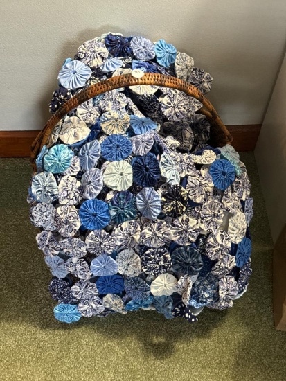 Blue and White Fabric Items with Wicker Basket