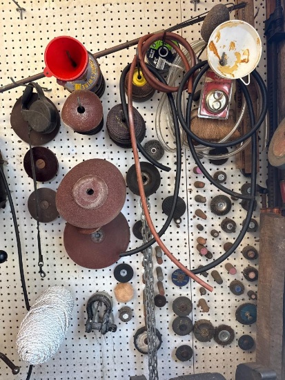 Wall Lot of Assorted Items Including Abrasives and Tools