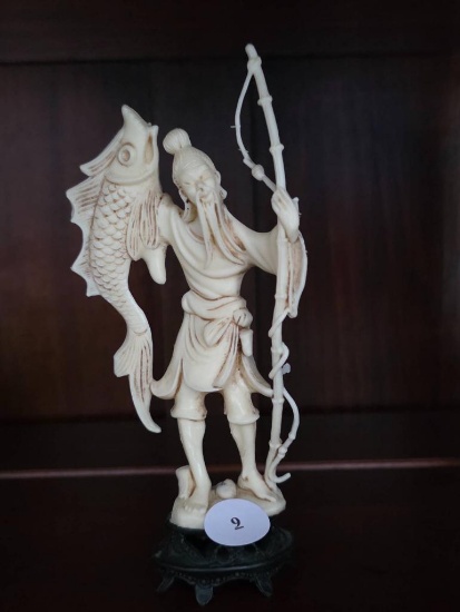 Plastic Figurine of a Fisherman With Fish, 6 1/2H