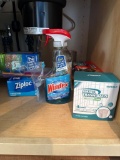 Cabinet Lot of Assorted Items Including Cleaning and Storage Supplies