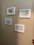 Contents of Bathroom Featuring Wall Art, Fish Decor, and Accessories ()