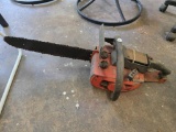Craftsman Chainsaw with Red Housing and Black Blade