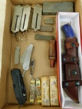 Box Lot with Misc. Knives - Fish Scales - Duck Call - Sharpening Stones