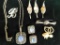 Group of 8 Pieces of Costume Jewelry - 6 Brooches - 1 Necklace / Earring Set