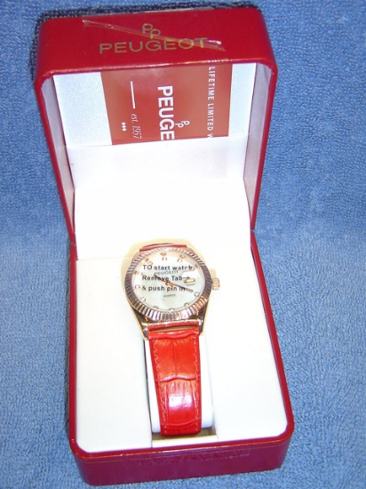 LADIES PEUGEOT COPPER/RED BAND WATCH RUNNING