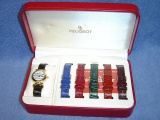 LADIES PEUGEOT GOLD TONE WATCH W/MULTI LEATHER BANDS RUNNING