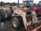 460 International Gas Utility with International 2000 Loader Forks and Bucket