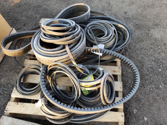 Pallet of misc belts for JD harvester