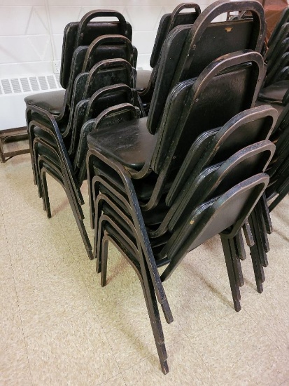 Stack of Black Cushioned Restaurant Chairs