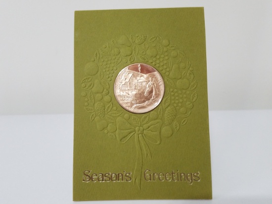 Old Christmas card with inset medallion coin