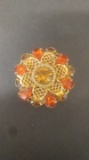 Orange rhinestone brooch