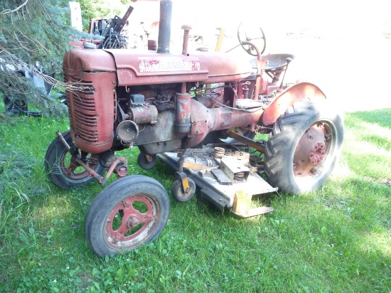 A McCormick Wide Front with Belly Mower