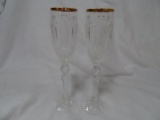 Set of 2 Waterford Champagne Flutes with Gold Rim.