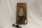 Electric lamp Mounted on piece of wood