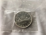 Set of 2 1962 & 1963 Canadian Dollars.