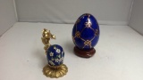 Lot of two blue painted eggs with holders