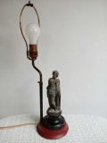 Vintage Lamp With a Brass Boy on the Stand