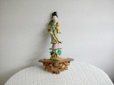 Asian Figurine on Shelf