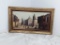 OIL ON CANVAS FRAMED DEPICTS WESTERN TOWN