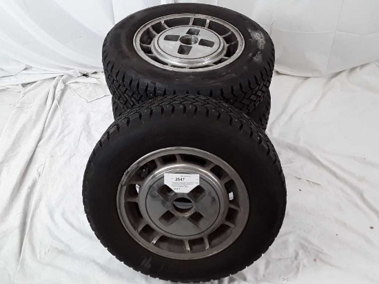 4 Snowtracker studded tires and aluminum wheels.