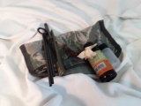 Military style gun cleaning kit in camo bag.