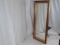 Large wall mirror with gold frame.