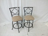 Pair of metal black and tan bar stools.