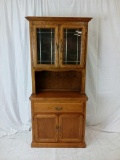 Two-piece oak china hutch with leaded glass doors