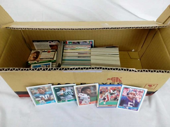 BOX HALF FILLED WITH FOOTBALL CARDS